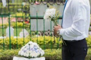 Saying goodbye with flowers in hand